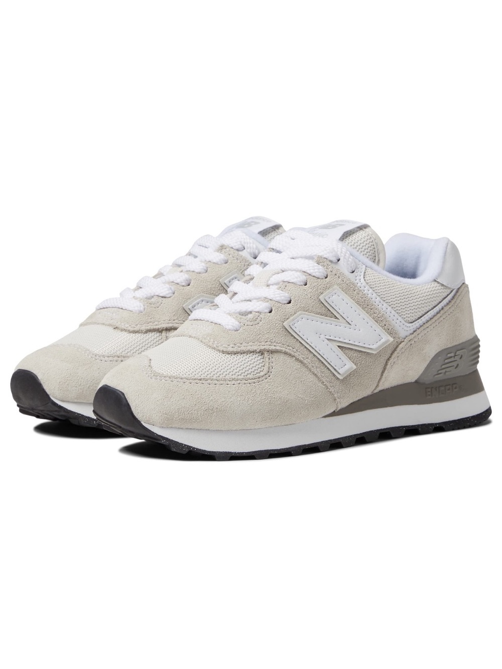 New Balance women’s 574 Retro Sneaker in Beige and White